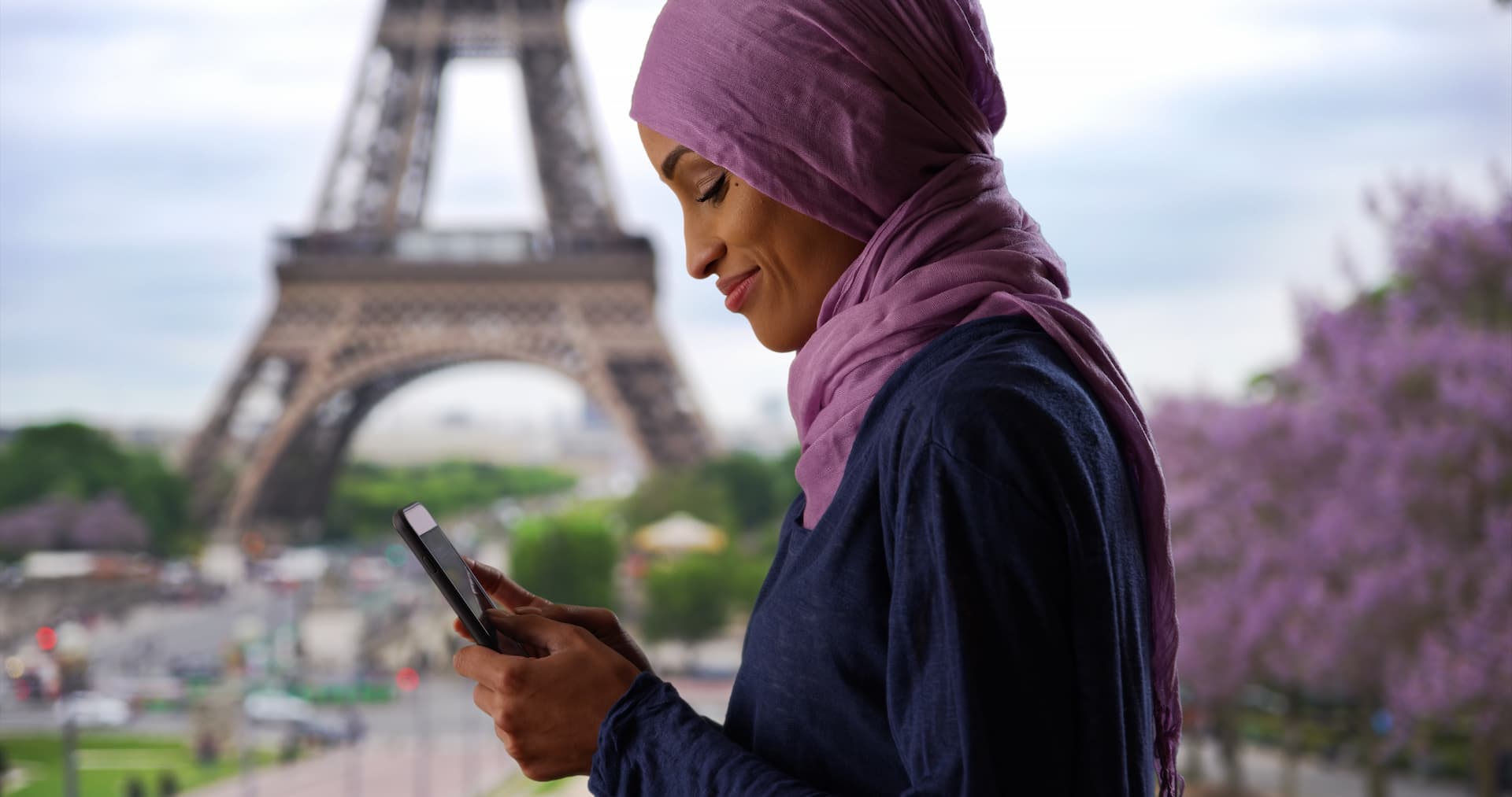 Woman holding a phone and smiling